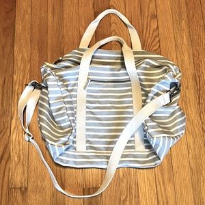 Known Supply
Duffle Bag. Grey and White stripes. Good condition